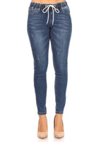 Skinny jeans with elastic waist and waist tie